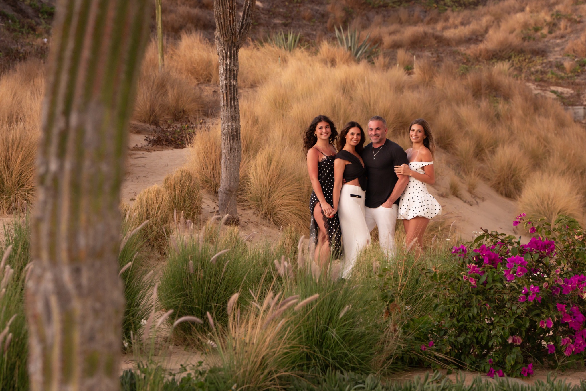 Mario Muñoz with his family in a warm outdoor portrait setting